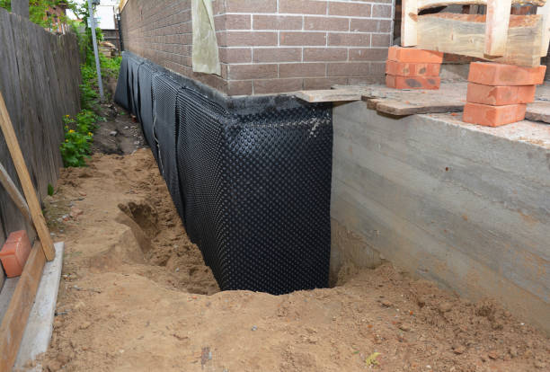 Happy homeowners after waterproofing job in Sobieski